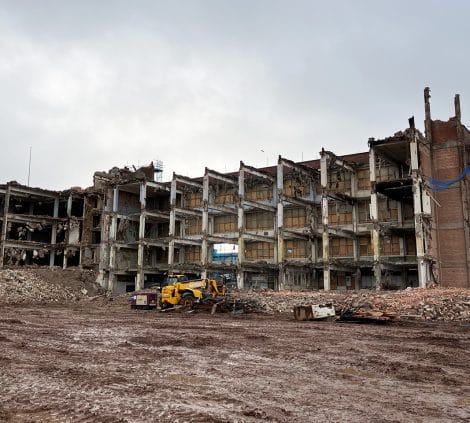 Engineer inspecting excavation during underground tank removal on construction site